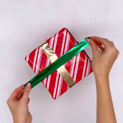 Metalized Tape to wrap a gift, making it look shiny and glamorous.